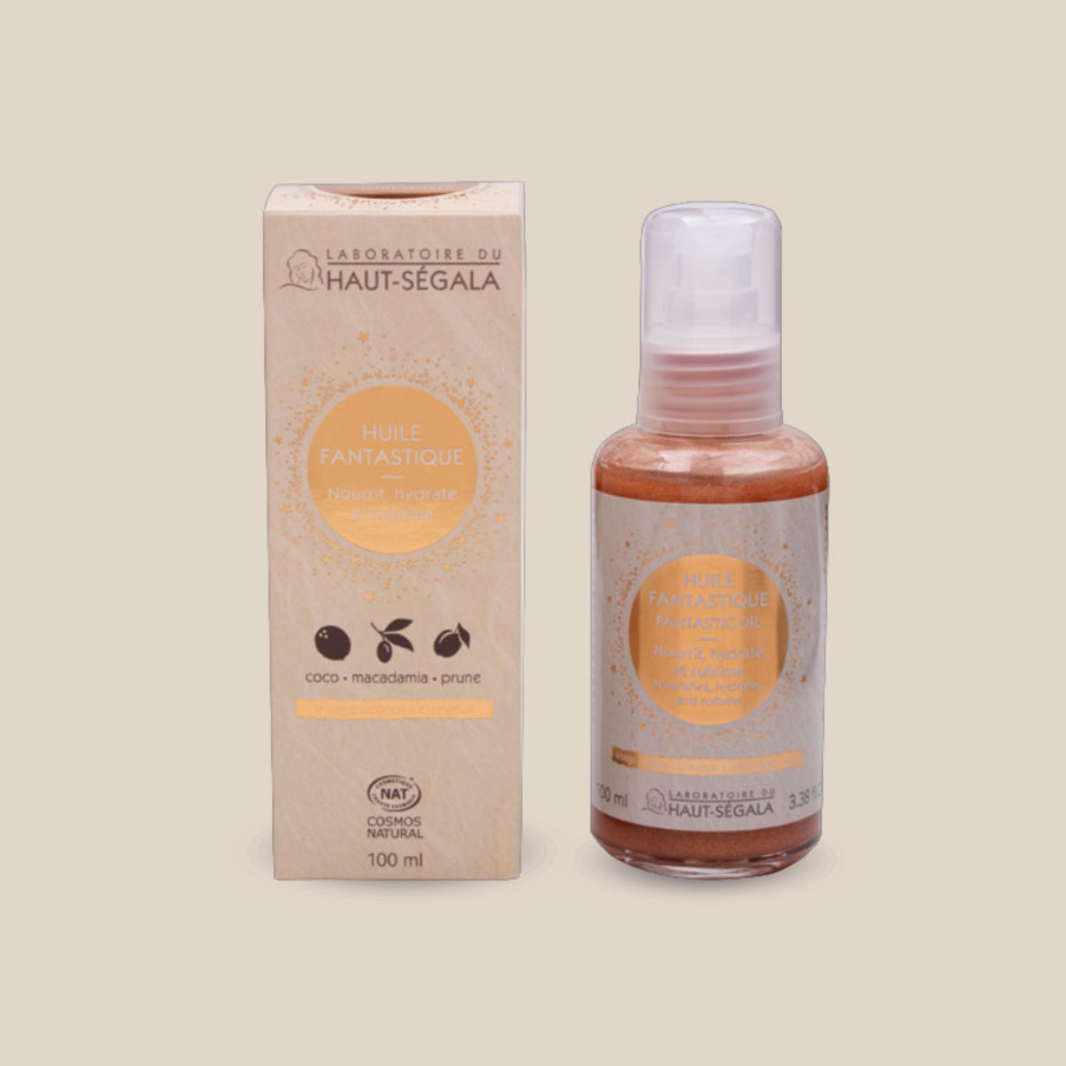 Photo produit : Huile fantastique du Laboratoire du Haut-Séguala, présentée dans un flacon transparent à pompe et une boîte recyclée, 100 ml, coco-macadamia-prune.
